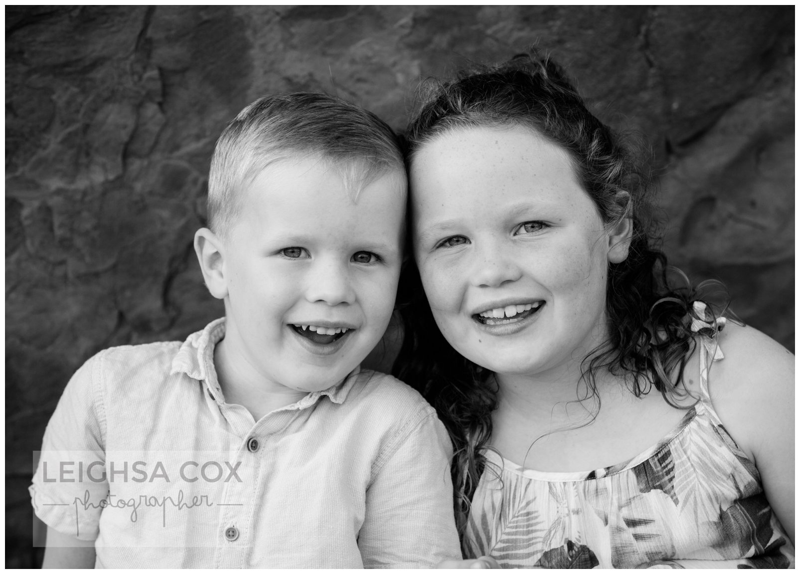 black and white sibling portrait