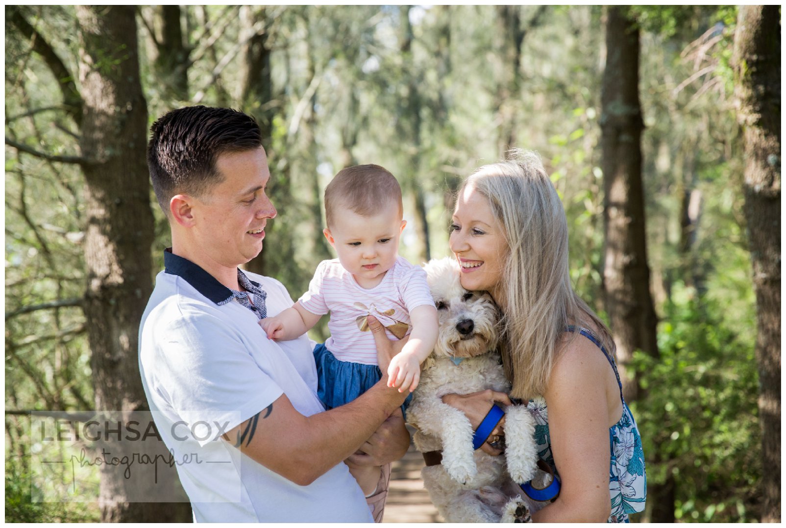 close family snuggles in the park