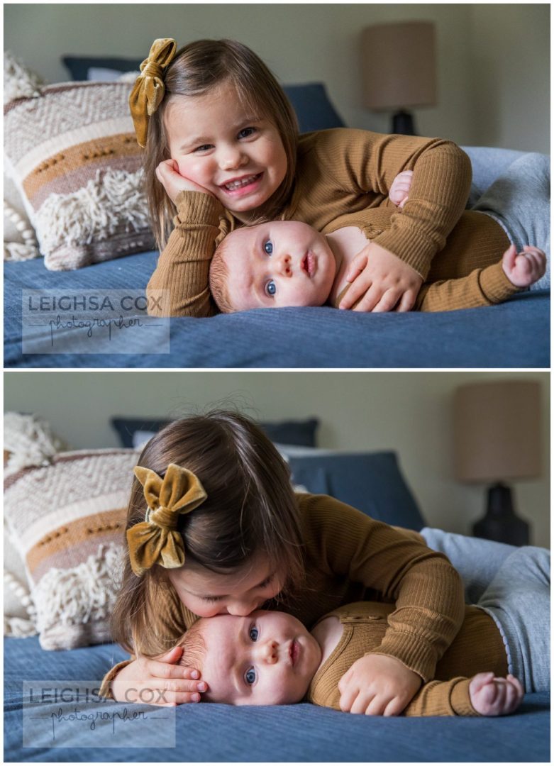 sweet sisters on bed cuddling