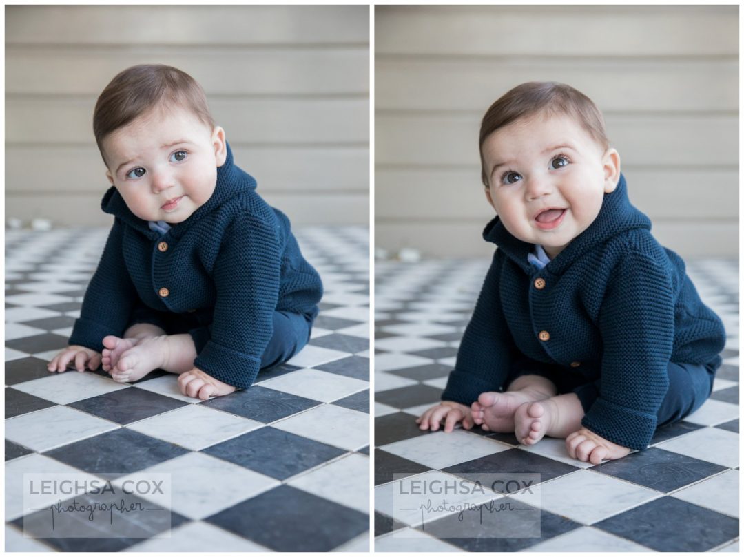 baby boy on checkered tiles