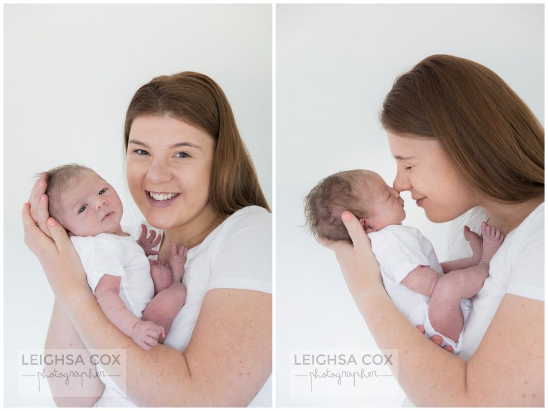 mum snuggles newborn