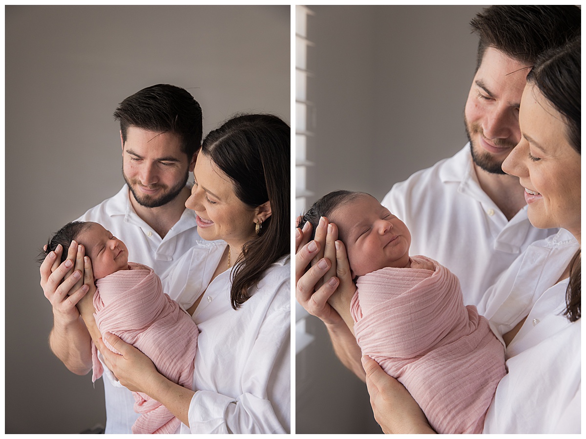 cuddles and smiles with newborn